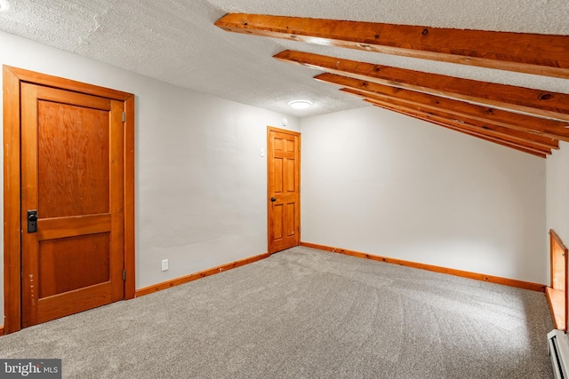 308 Cherry St, Columbia, PA 17512 - bonus room with carpet, baseboard heating, baseboards, and a textured ceiling