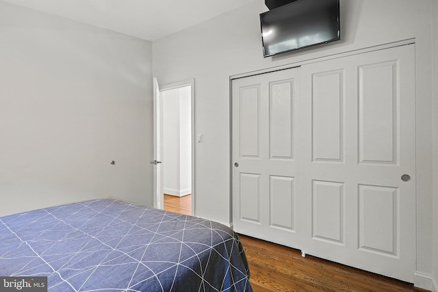 3503 Arborwood Ct, Baltimore, MD 21208 - bedroom with dark wood-style flooring and a closet