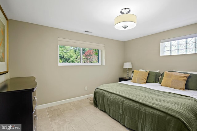 3503 Arborwood Ct, Baltimore, MD 21208 - bedroom with multiple windows and baseboards
