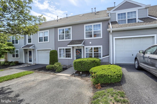 1328 N W St, Carlisle, PA 17013 - view of property featuring a garage, roof with shingles, and asphalt driveway