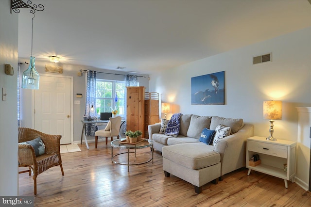 1328 N W St, Carlisle, PA 17013 - living room with light wood-style floors and baseboards