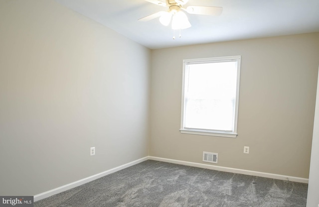 8514 Magnolia Dr, Lanham, MD 20706 - spare room with dark colored carpet, baseboards, and ceiling fan