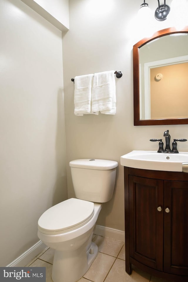 8514 Magnolia Dr, Lanham, MD 20706 - bathroom with vanity, toilet, tile patterned floors, and baseboards