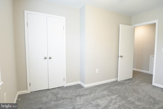 8514 Magnolia Dr, Lanham, MD 20706 - unfurnished bedroom featuring carpet flooring, baseboards, and a closet