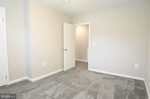 8514 Magnolia Dr, Lanham, MD 20706 - carpeted empty room with baseboards