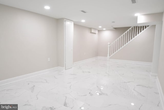 8514 Magnolia Dr, Lanham, MD 20706 - finished below grade area with baseboards, recessed lighting, light marble finish floors, and stairway