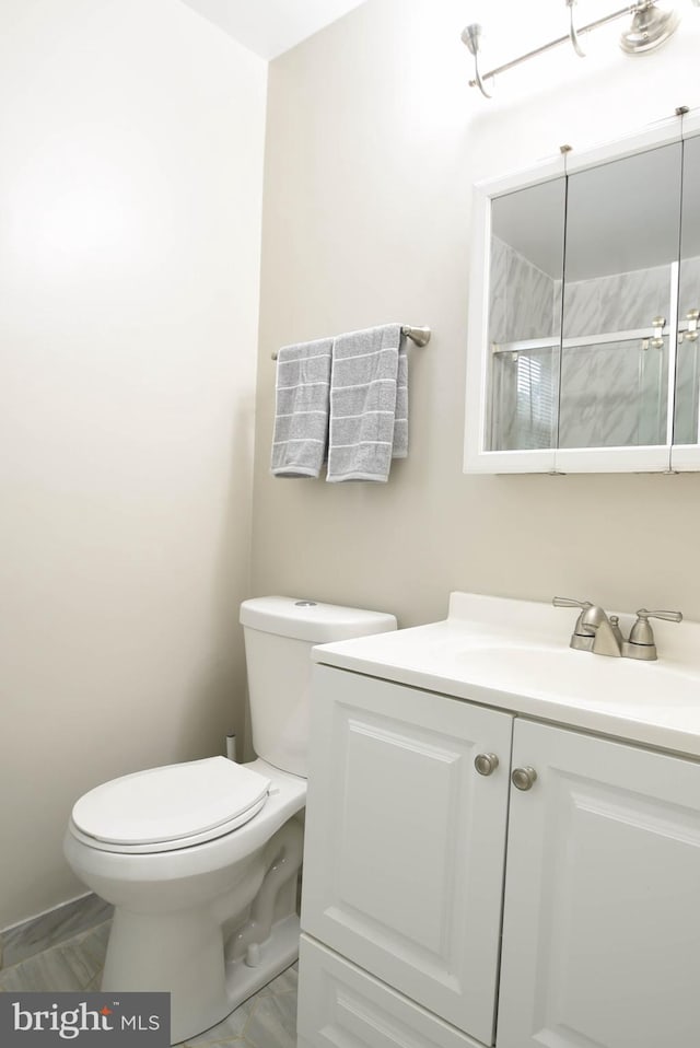 8514 Magnolia Dr, Lanham, MD 20706 - bathroom featuring vanity, toilet, and a shower