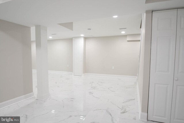 8514 Magnolia Dr, Lanham, MD 20706 - finished basement with recessed lighting, baseboards, and light marble finish flooring