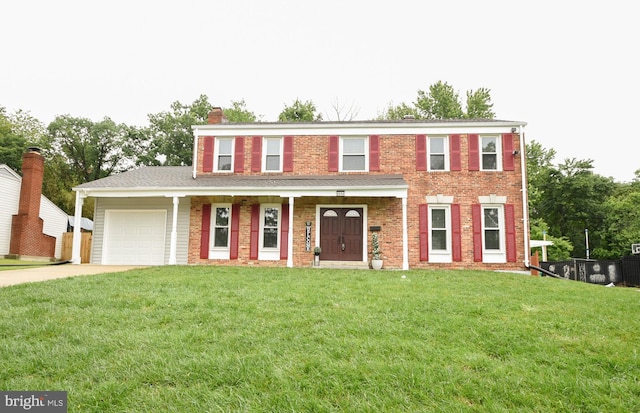 8514 Magnolia Dr, Lanham, MD 20706 - view of front of property with an attached garage, driveway, a chimney, brick siding, and a porch