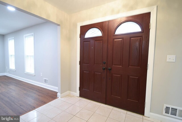 8514 Magnolia Dr, Lanham, MD 20706 - entryway with baseboards and light tile patterned floors