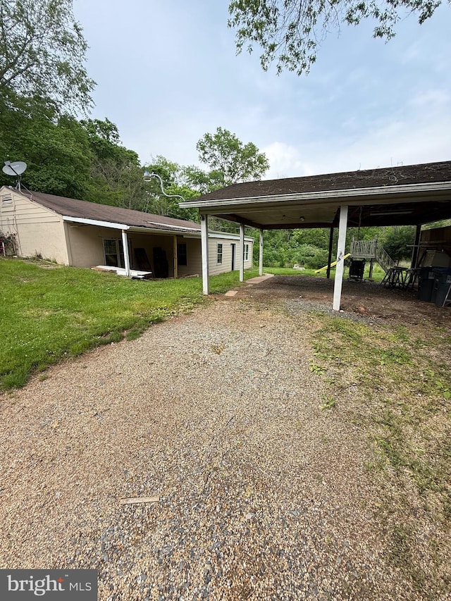 7421 Lake Dr, Manassas, VA 20111 - view of parking / parking lot featuring a carport