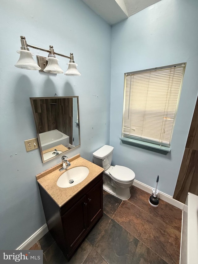 7421 Lake Dr, Manassas, VA 20111 - bathroom featuring vanity, baseboards, and toilet