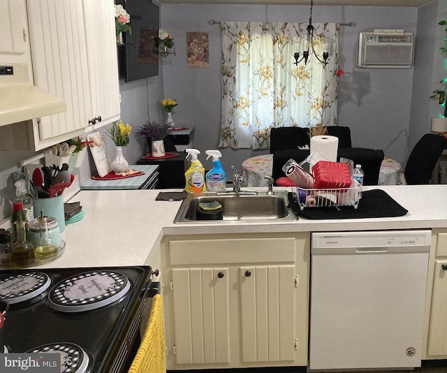 200 Winding Way Unit 13, Downingtown, PA 19335 - kitchen featuring white dishwasher, a wall mounted AC, light countertops, ventilation hood, and a sink