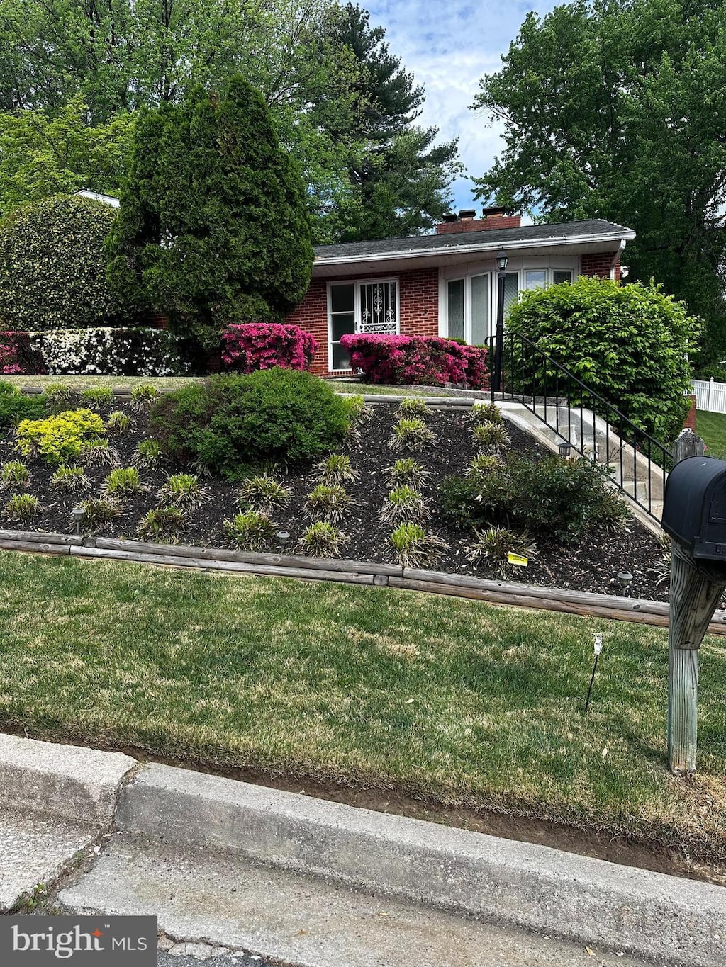 6708 Selkirk Rd, Baltimore, MD 21239 - view of front of property featuring brick siding and a chimney
