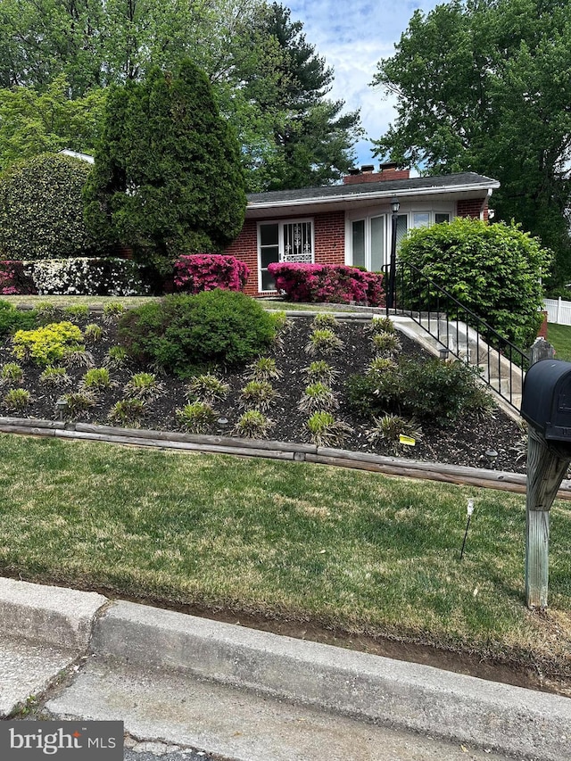 6708 Selkirk Rd, Baltimore, MD 21239 - view of front of property featuring brick siding and a chimney