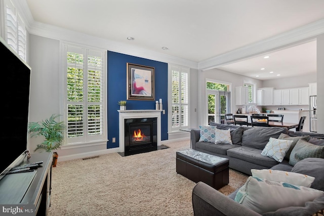 42743 Macauley Pl, Ashburn, VA 20148 - living room featuring carpet flooring, recessed lighting, a fireplace with flush hearth, plenty of natural light, and crown molding