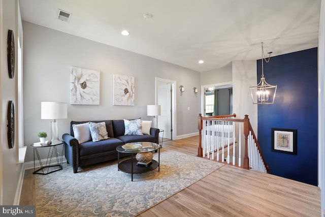 42743 Macauley Pl, Ashburn, VA 20148 - living area with wood finished floors, baseboards, a chandelier, and recessed lighting