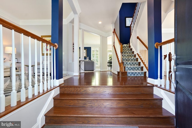 42743 Macauley Pl, Ashburn, VA 20148 - stairs with crown molding, wood finished floors, and baseboards