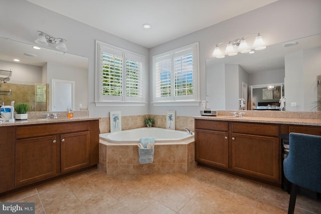 42743 Macauley Pl, Ashburn, VA 20148 - bathroom featuring a bath, a tile shower, two vanities, and tile patterned floors
