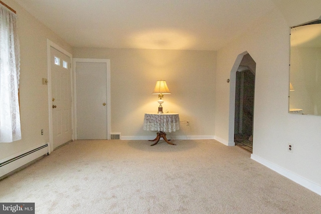 102 S Poplar Ave, Maple Shade, NJ 08052 - carpeted spare room with arched walkways, a baseboard radiator, and baseboards
