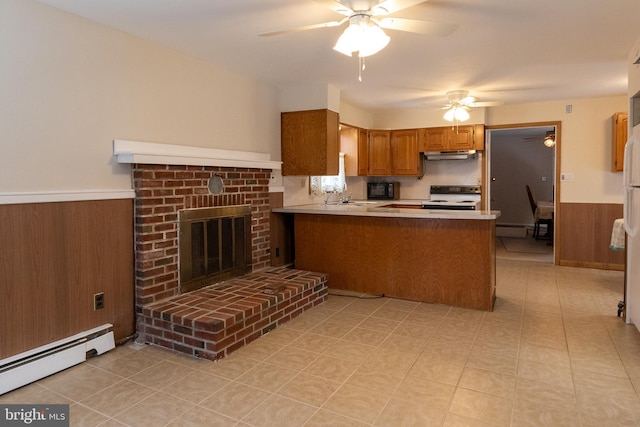 102 S Poplar Ave, Maple Shade, NJ 08052 - kitchen featuring electric range, a baseboard heating unit, brown cabinetry, ceiling fan, and wainscoting