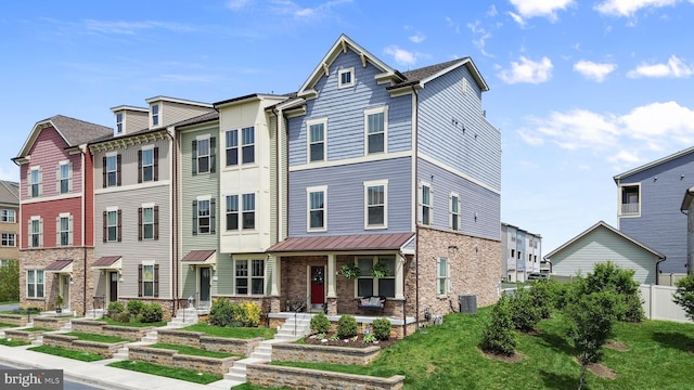 3451 Flatwoods Dr, Frederick, MD 21704 - view of property featuring central air condition unit, a porch, a residential view, and fence