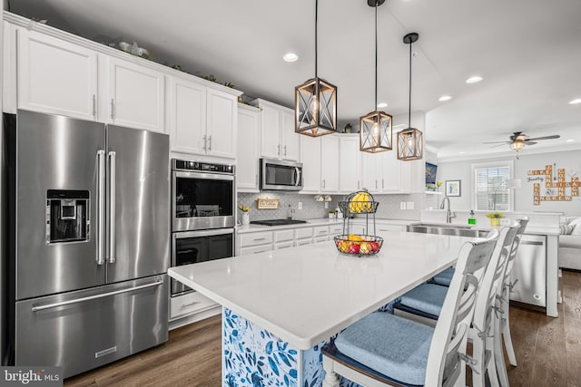 3451 Flatwoods Dr, Frederick, MD 21704 - kitchen with stainless steel appliances, a sink, dark wood-style floors, recessed lighting, and light countertops