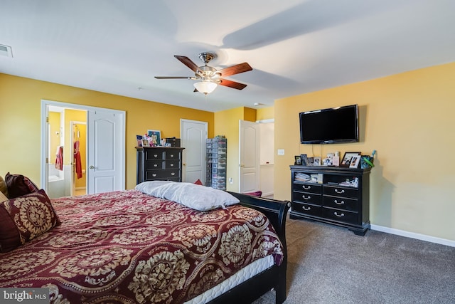 15603 Chadsey Ln, Brandywine, MD 20613 - bedroom with dark carpet, baseboards, connected bathroom, and a ceiling fan