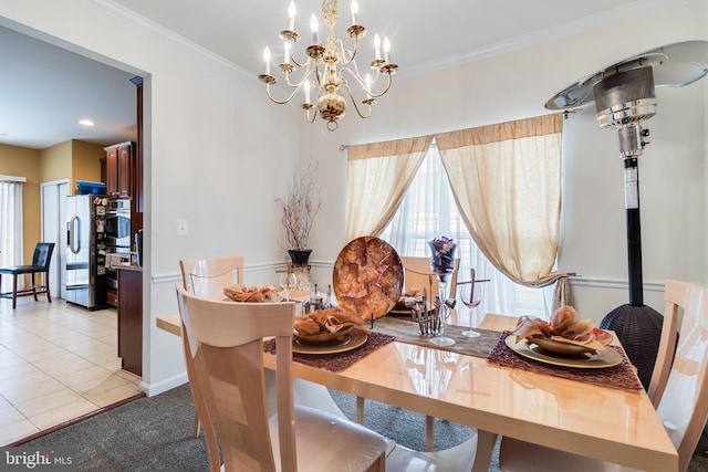 15603 Chadsey Ln, Brandywine, MD 20613 - dining area with healthy amount of natural light, a chandelier, ornamental molding, light tile patterned floors, and baseboards