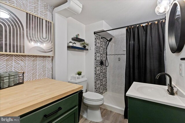 272 Main St, Hamilton, NJ 08620 - bathroom featuring vanity, a stall shower, toilet, and wood finished floors