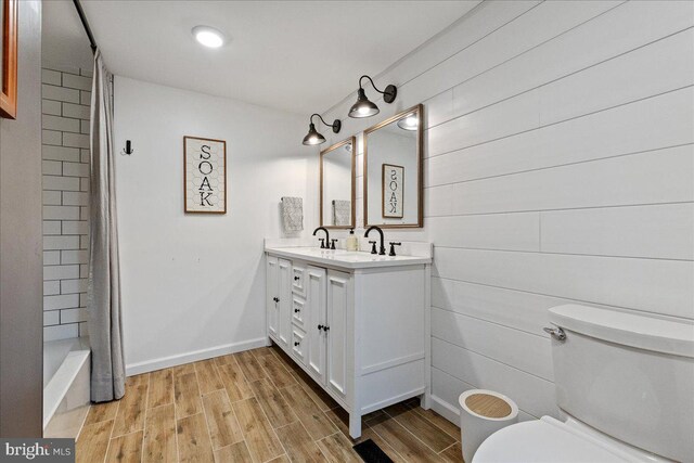 272 Main St, Hamilton, NJ 08620 - bathroom with toilet, wood finished floors, vanity, and baseboards