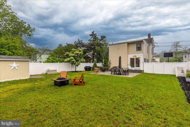272 Main St, Hamilton, NJ 08620 - view of yard with a fire pit, an outdoor structure, a shed, and a patio