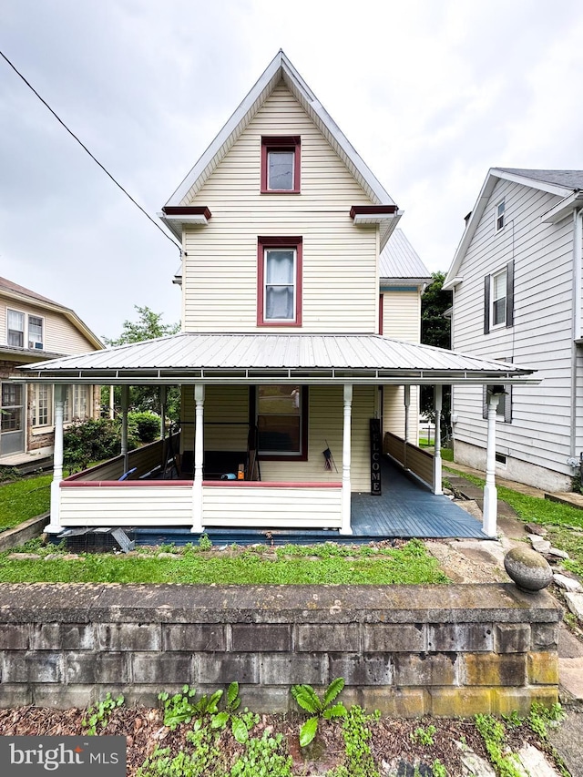 31 S Mann Ave, Yeagertown, PA 17099 - back of house featuring metal roof, a standing seam roof, and a porch