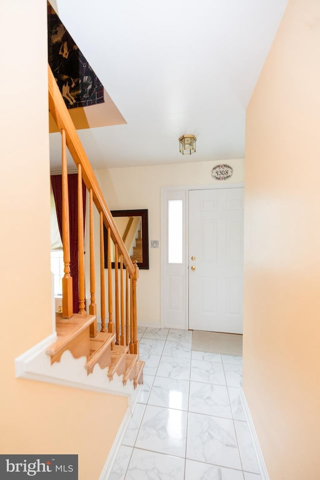 4308 Joshua Court, St, MD 21154 - foyer entrance with stairs, marble finish flooring, and baseboards