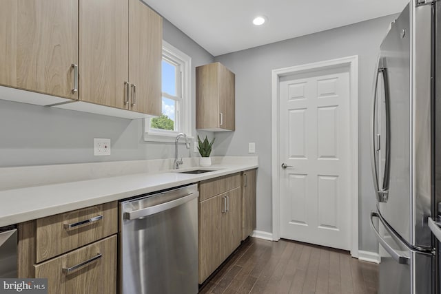 402 Bay View Dr, Edgewater, MD 21037 - kitchen featuring stainless steel appliances, a sink, dark wood-type flooring, baseboards, and light countertops