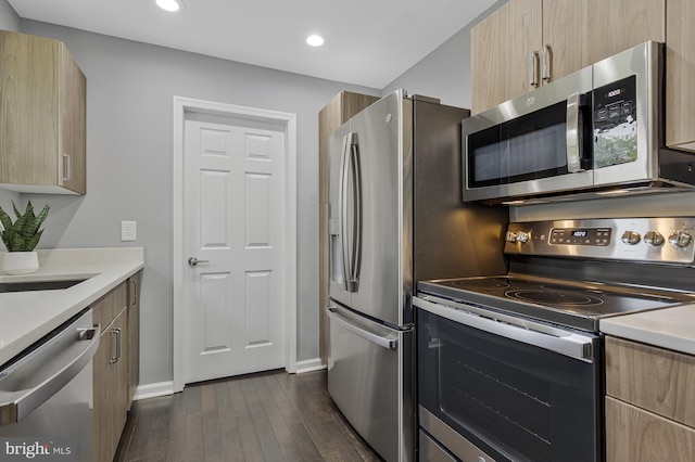 402 Bay View Dr, Edgewater, MD 21037 - kitchen featuring appliances with stainless steel finishes, dark wood-style floors, light brown cabinets, light countertops, and modern cabinets