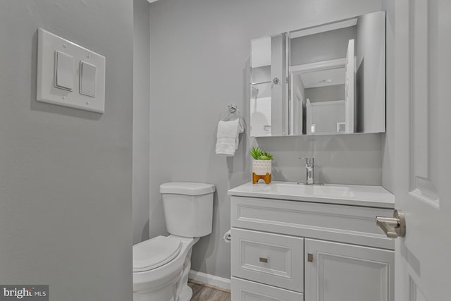 402 Bay View Dr, Edgewater, MD 21037 - bathroom featuring toilet, baseboards, vanity, and wood finished floors