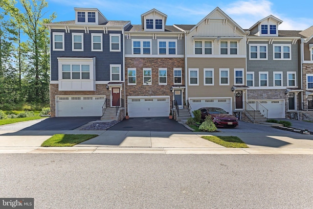 7109 Yamhill Way, Glen Burnie, MD 21060 - multi unit property with board and batten siding, driveway, a garage, and stone siding