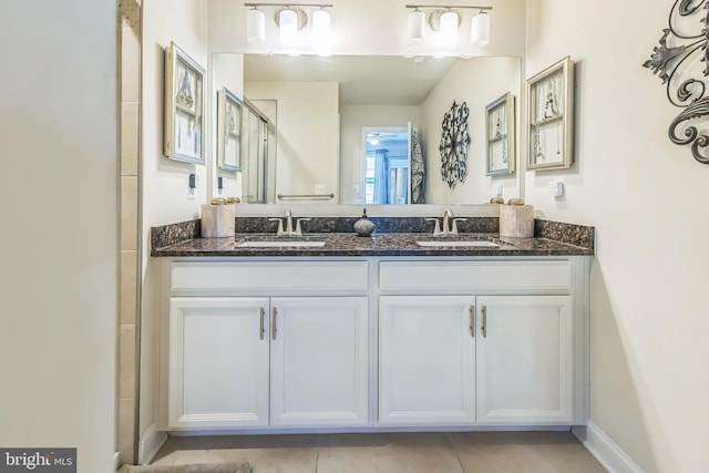 7109 Yamhill Way, Glen Burnie, MD 21060 - bathroom featuring a shower with shower door, double vanity, and tile patterned floors