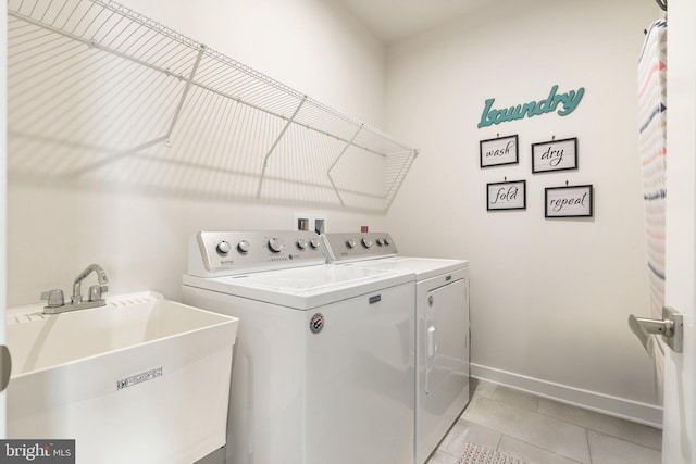 120 Bayhill Ter, Lake Frederick, VA 22630 - laundry room with separate washer and dryer, light tile patterned floors, and baseboards