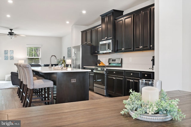 120 Bayhill Ter, Lake Frederick, VA 22630 - kitchen with appliances with stainless steel finishes, a sink, a center island with sink, recessed lighting, and ceiling fan