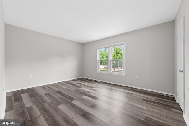 9048 Bonham Cir, Manassas, VA 20110 - spare room with wood finished floors and baseboards