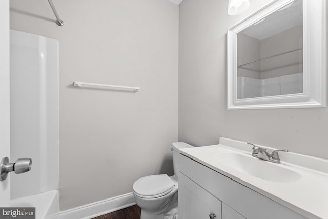 9048 Bonham Cir, Manassas, VA 20110 - bathroom with vanity, toilet, baseboards, and wood finished floors