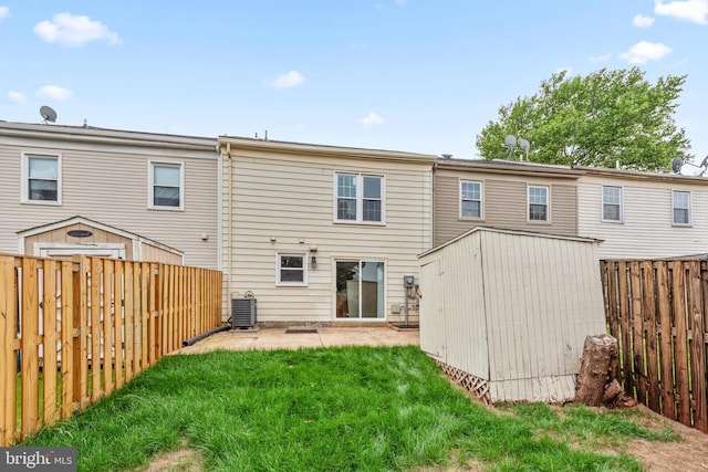 9048 Bonham Cir, Manassas, VA 20110 - rear view of property with a shed, a patio, an outbuilding, and central AC