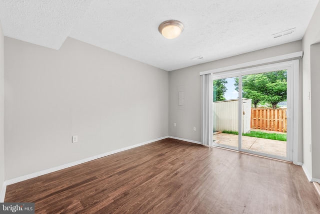 9048 Bonham Cir, Manassas, VA 20110 - unfurnished room with wood finished floors, a textured ceiling, and baseboards
