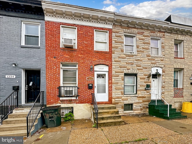 1232 W Pratt St, Baltimore, MD 21223 - townhome / multi-family property featuring entry steps and stone siding