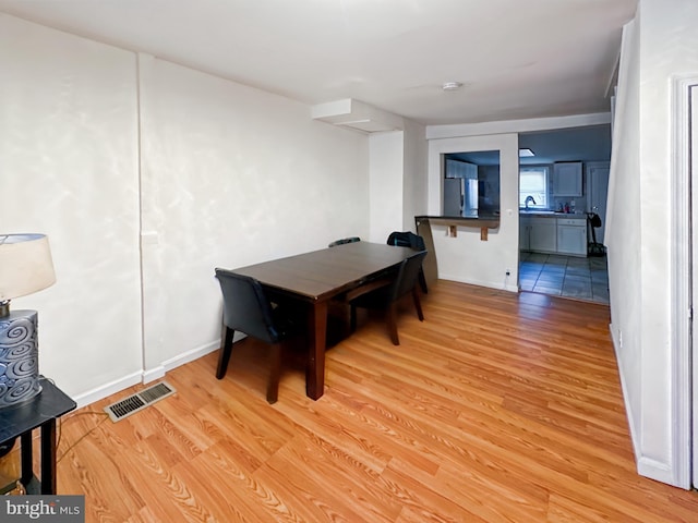 1232 W Pratt St, Baltimore, MD 21223 - dining area featuring light wood-style flooring