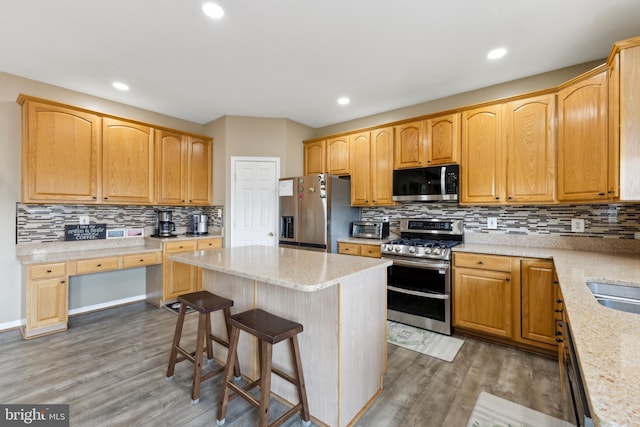 7 Otto Way, Fredericksburg, VA 22406 - kitchen featuring stainless steel appliances, backsplash, wood finished floors, a kitchen island, and recessed lighting