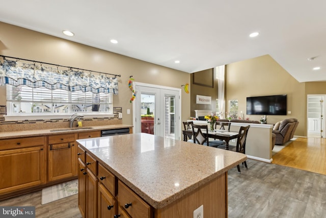 7 Otto Way, Fredericksburg, VA 22406 - kitchen with a sink, light wood-style flooring, brown cabinetry, light stone counters, and recessed lighting