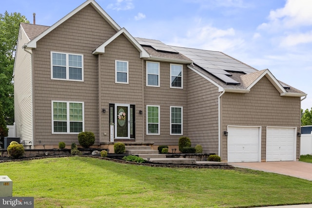106 Hedgerow Ct, Deptford, NJ 08096 - view of front facade featuring solar panels, driveway, a front yard, an attached garage, and roof with shingles